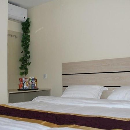Dalian Kai Bin Business Inn Далянь Экстерьер фото